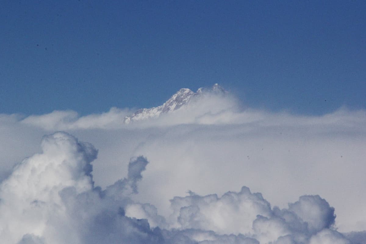 A photograph of Mt. Everest taken above the clouds